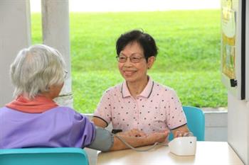 Mdm Chong talking to senior Mdm Chong talking to senior