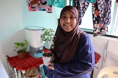 Mdm Rosilah enjoys gardening Mdm Rosilah enjoys gardening