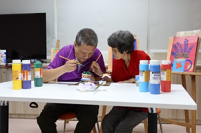 Mdm Tan and son doing activity