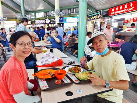 Mdm Chong and Mr Gian enjoying a meal Mdm Chong and Mr Gian enjoying a meal