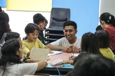 Rizki guiding TYA children on an activity-2 Rizki guiding TYA children on an activity-2